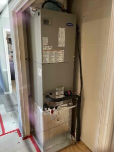 a water heater sitting in the corner of a room