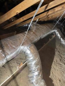 a pile of wood and plastic wrapped around a pipe