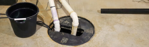 A sump pump in a home basement