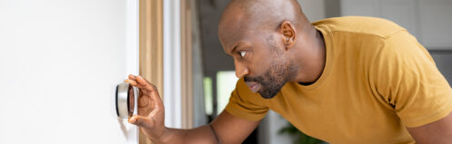 Homeowner checking thermostat ac not working